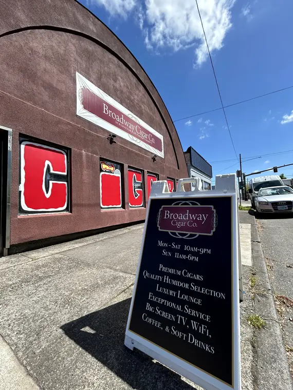 Find the red CIGARS sign
